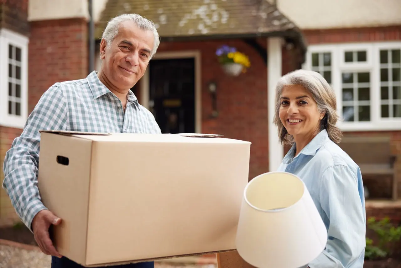 an elderly couple in the middle of downsizing