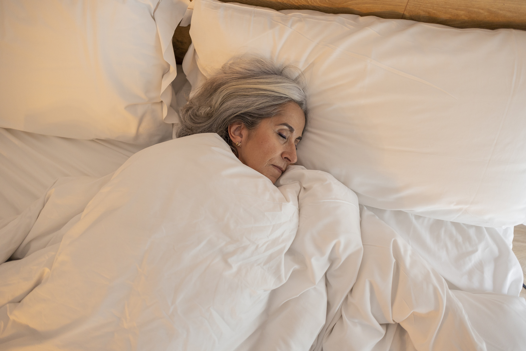 An old woman sleeping soundly in her bed